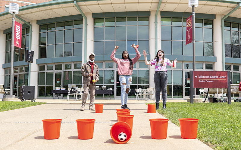 students on the MSC patio playing a game