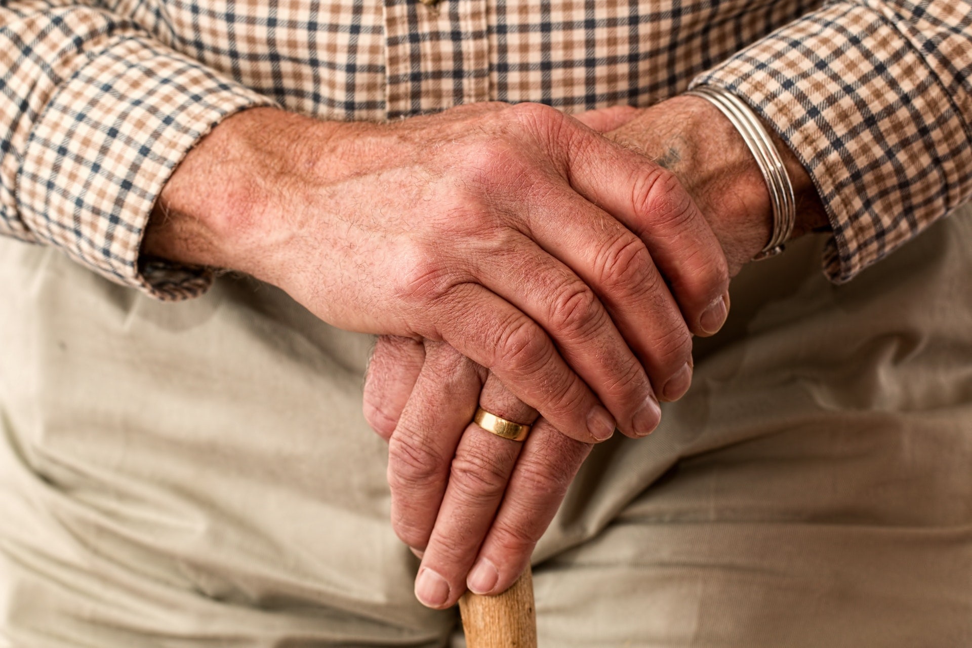 Man with hands folded in front of him