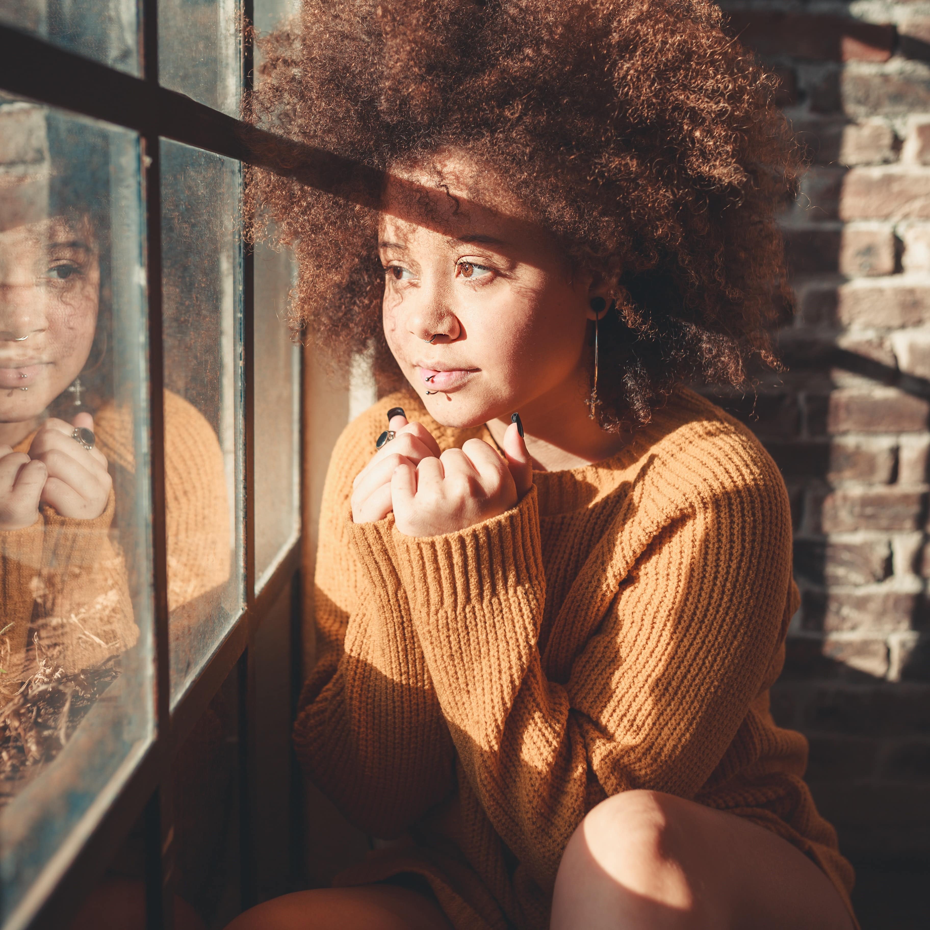 Little girl looking out of a window