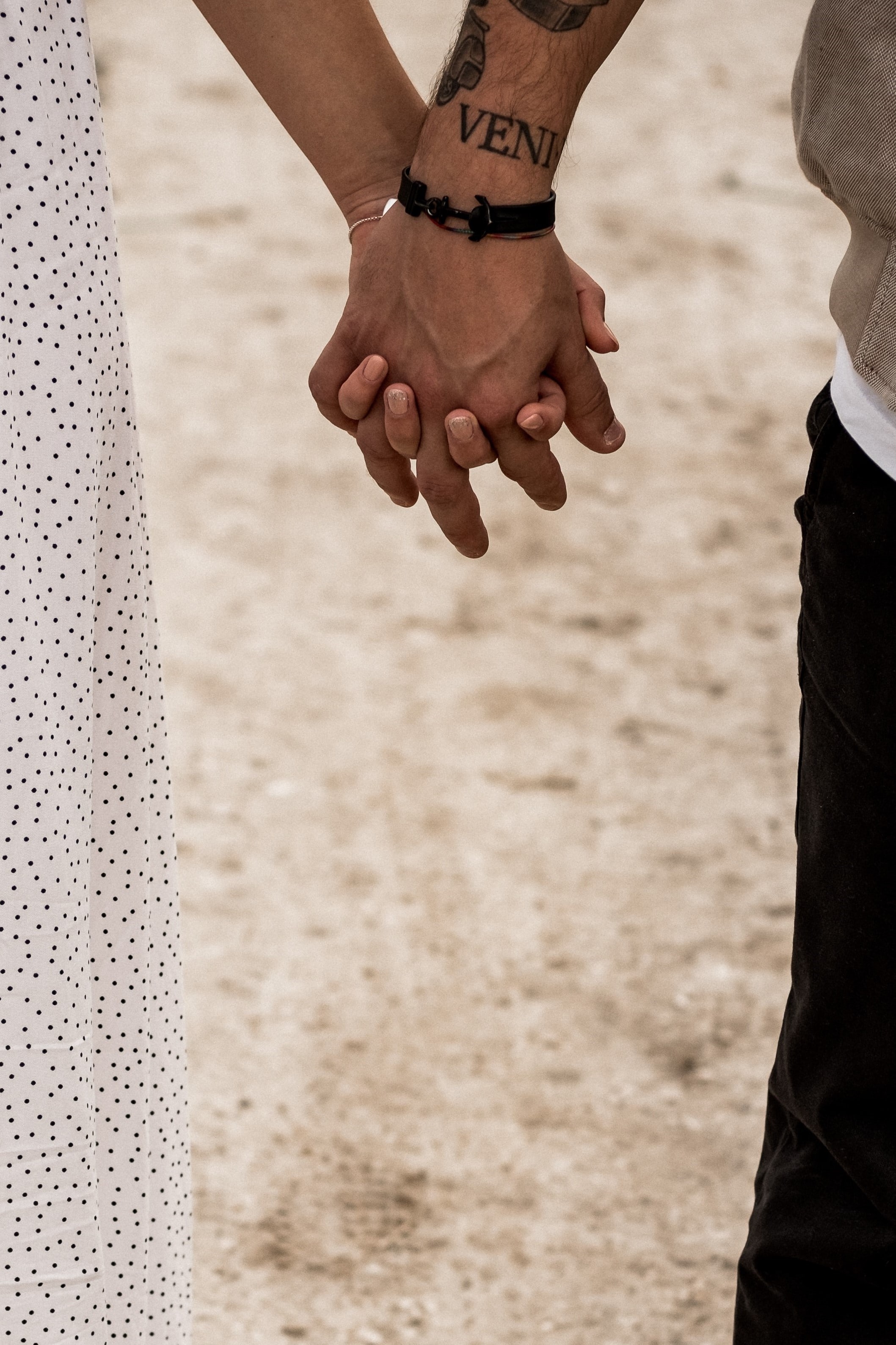 Couple holding hands