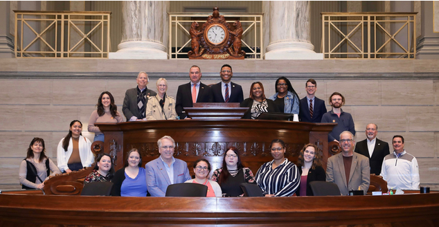 Adjunct Professor Jim Wallis and social work students inside the State Capitol