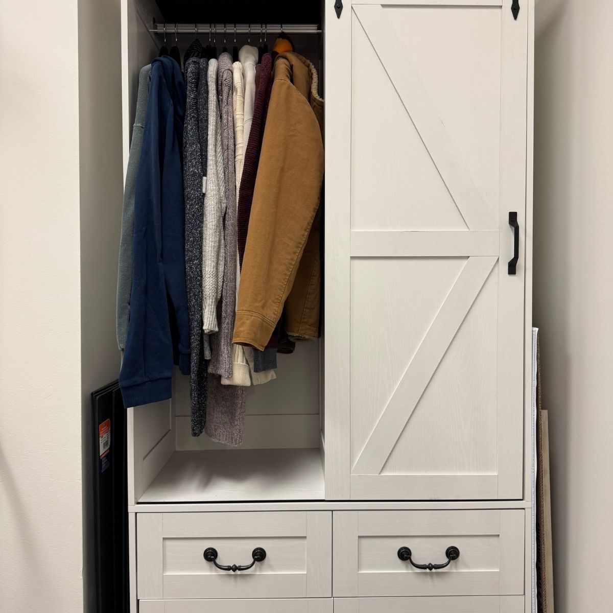 Clothing closet featuring winter jackets