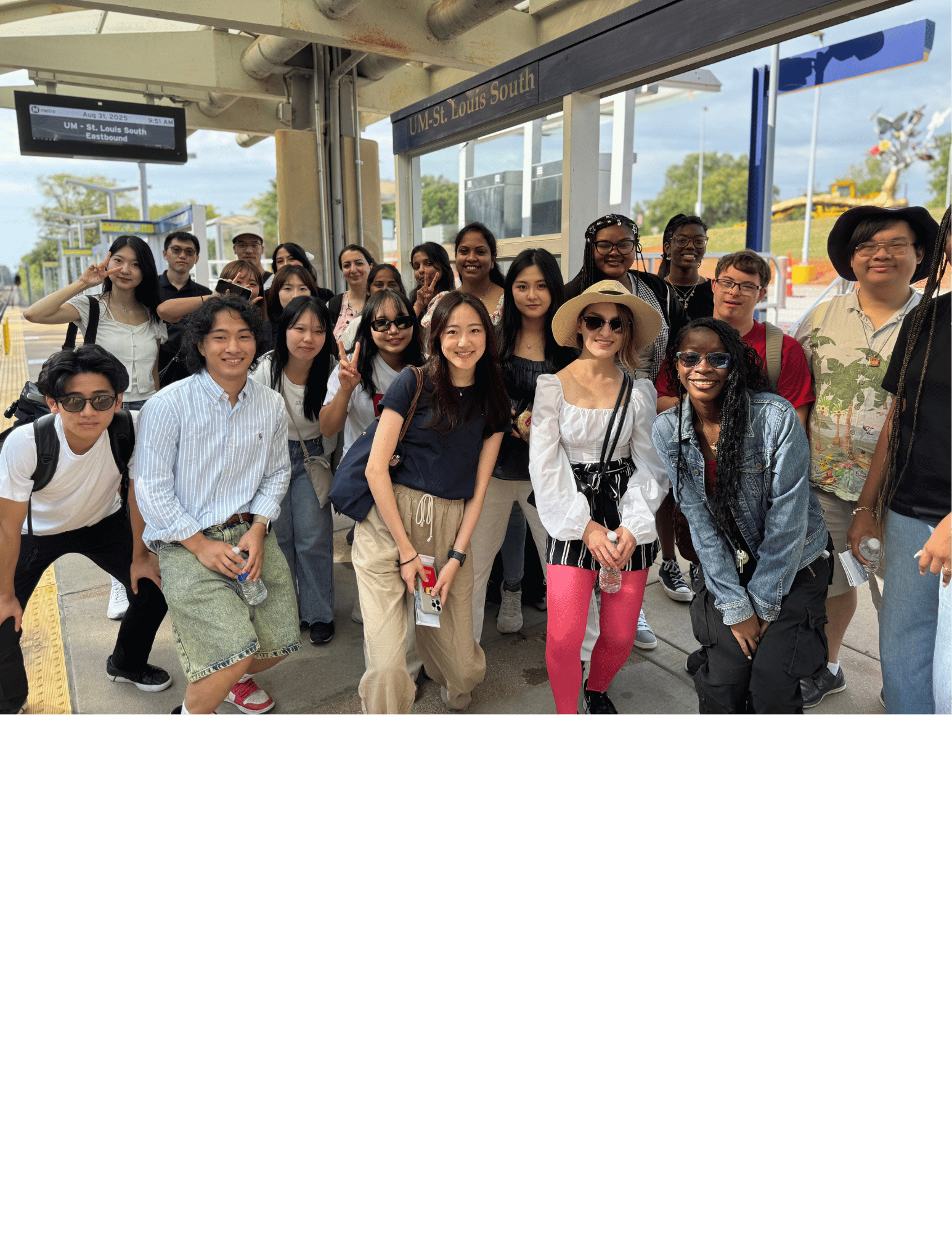 Students posing for a picture at the UMSL South Metro Stop