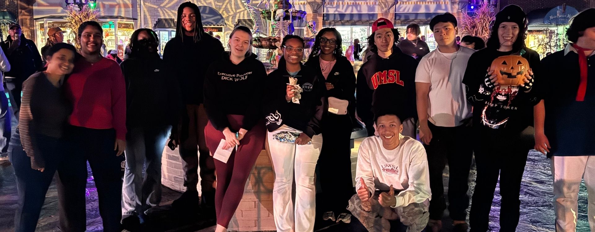 Group of students in Halloween costumes at Sx Flags Fright Fest