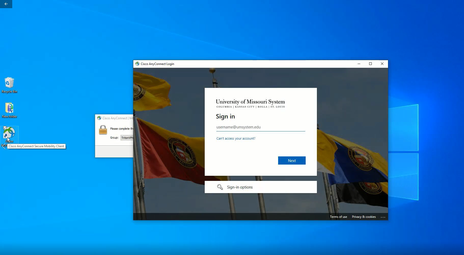 Login screen for the University of Missouri System with a backdrop of flags.