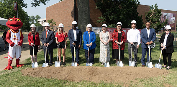Group of people with shovels at groundbreaking