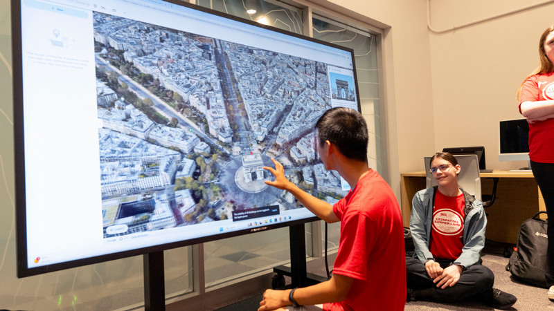student looking at geospatial map