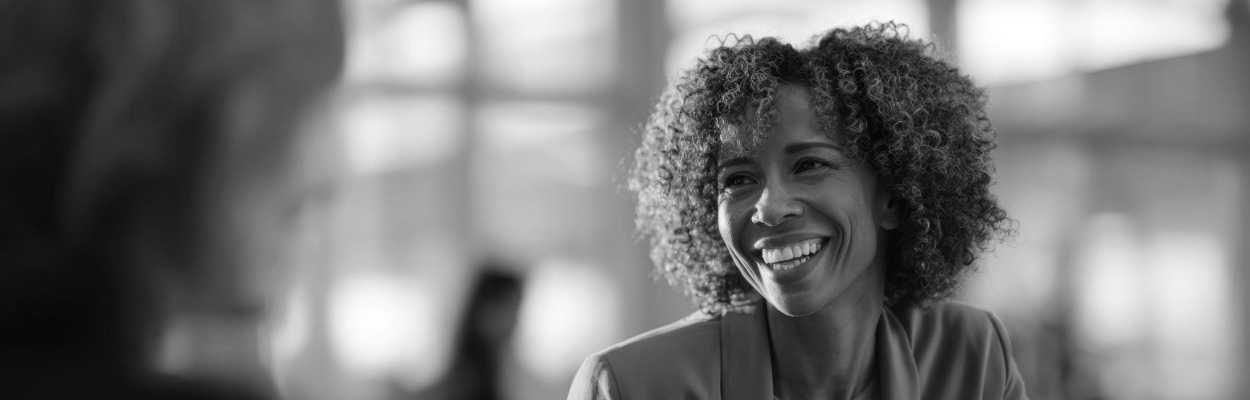 Someone smiling and looking off to the right