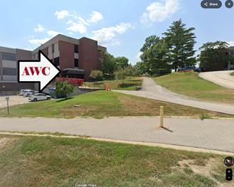 View of a building with a prominent arrow pointing to “AWC” in a Google Maps image.