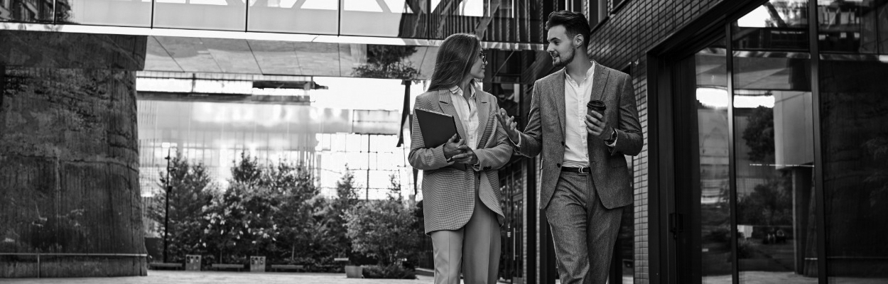 Two team members walking and talking