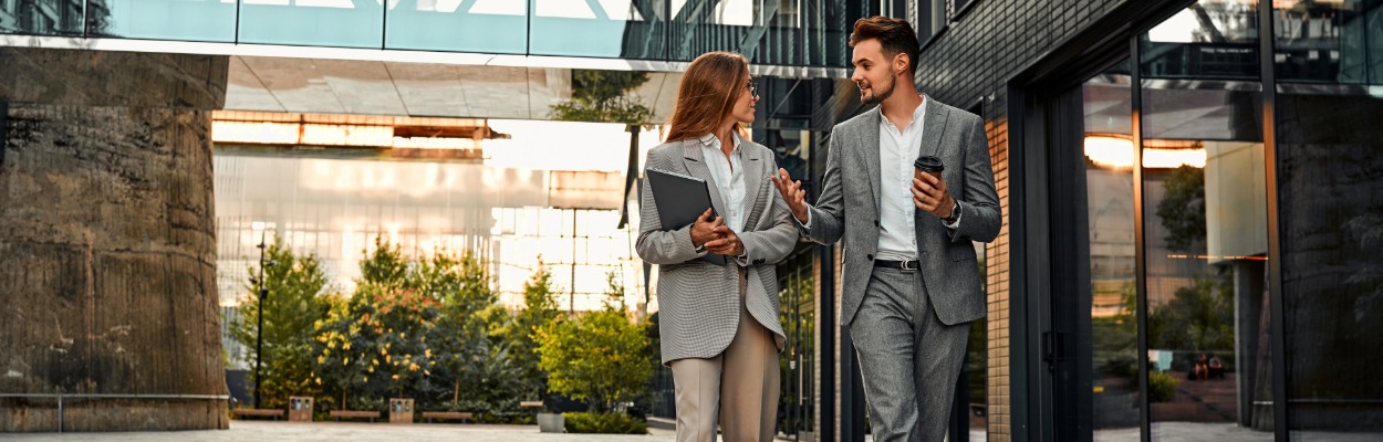 Two team members walking and talking