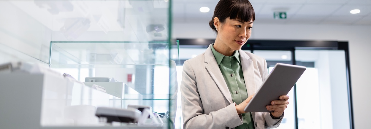 woman looking at tablet