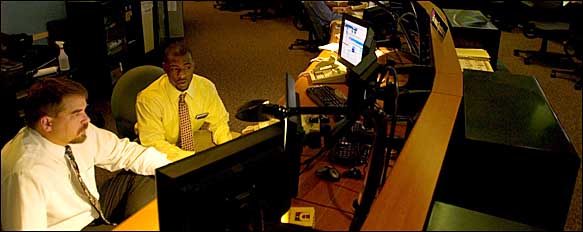 At I.B.M.'s Global Services network command center in Boulder, Colo., workers monitor a variety of threats to computer security.
