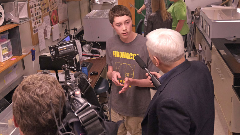 KETC’s Jim Kirchherr (right) interviews Parkway Central High School student Lucas Shanker about research he is conducting on bee behavior as part of the 2015 STARS summer program at UMSL. (Photos by August Jennewein)